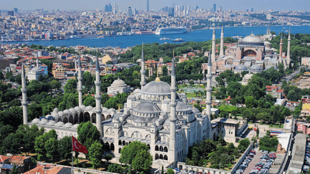 Aerial view of Istanbul featuring the Blue Mosque, Hagia Sophia, and the Bosphorus Strait, showcasing Turkey’s rich history and architecture.