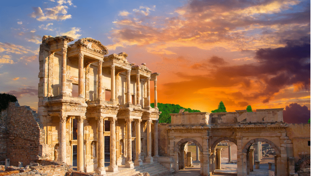 The ancient Library of Celsus in Ephesus, Turkey, at sunset with dramatic skies, showcasing Turkey’s historical landmarks and cultural heritage.