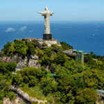 Christ the Redeemer overlooking Rio de Janeiro with mountains, ocean, and city skyline – one of the best places to visit in Brazil.